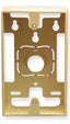 Ivory single gang surface mounting box with cutout for outlet, showing brass hardware and wall-mount slots