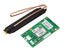 2GIG Cell Radio Module with green circuit board and black external antenna with copper connector and wrist strap