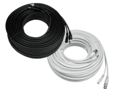 Coil of black RG59 video and power cable next to white RG59 cable coil with BNC and DC connectors