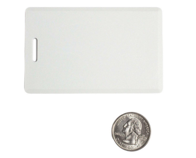 C702-E6G white proximity card with slot and handle shown next to quarter for size reference Main image