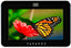 Paradox Touch Intuitive Touchscreen in Piano Black displaying vibrant nature image with monarch butterfly on red flower